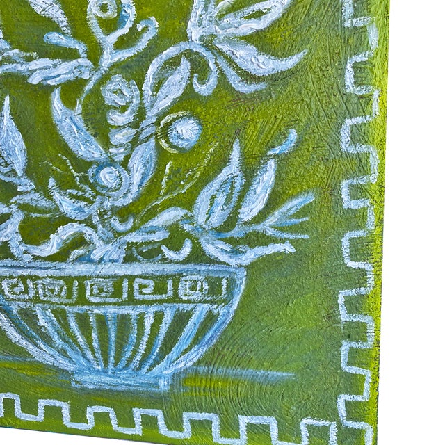 A striking original painting featuring an overflowing floral basket rendered in soft sky blue against a rich chartreuse...