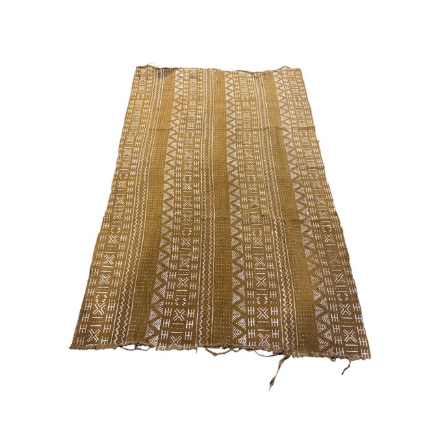 Authentic handwoven mud-cloth textile from Mali, crafted by artisans of the Bamana tribe. This striking cotton fabric...