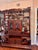 Brown Asymmetrical Multi-Tiered Curio Cabinet / Display Hutch: For Sale - Image 8 of 9