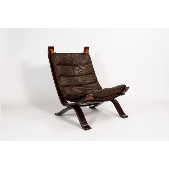 Original Focus sling-type lounge chair, manufactured by Bramin Møbler in the 1970s. The chair contains a dark brown colour...