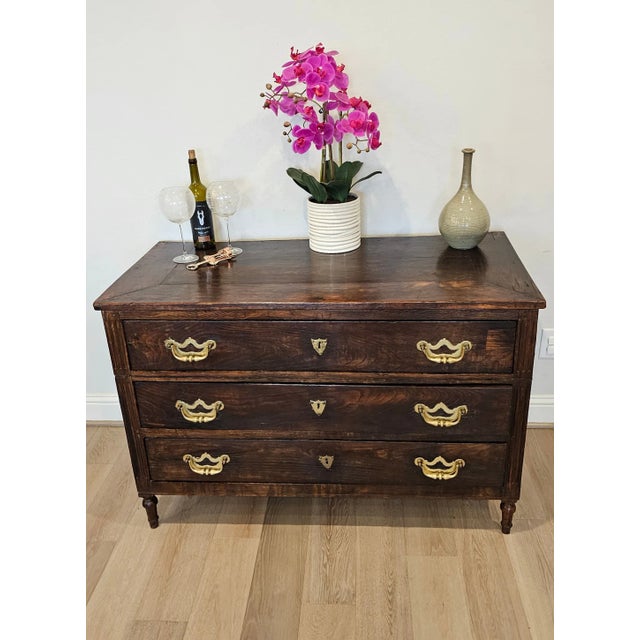 A handsome rustic antique Italian walnut chest of drawers commode. circa 1780 Hand-made in Italy in the second half of the...