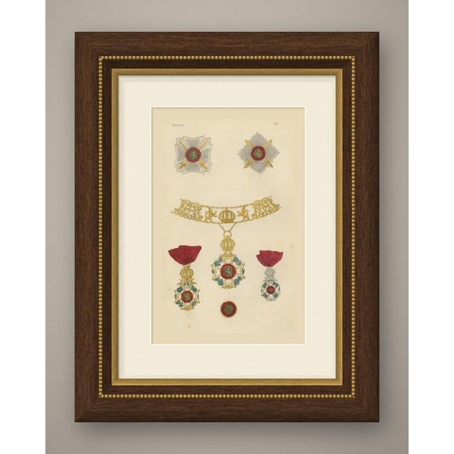 This is an original antique wood engraving, colored by hand, showing insignia of the order of leopold of belgium. At the...