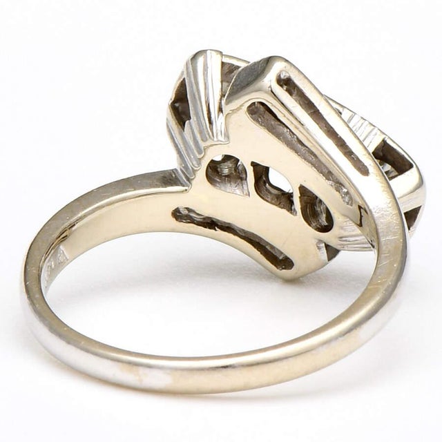 The timeless beauty and allure of this Old European diamond 14K white gold ring is spectacular. The angled, crisscross...