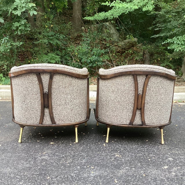 Striking pair of mid-century slipper chairs attributed to Ico Parisi, featuring sculptural walnut frames and dramatic...
