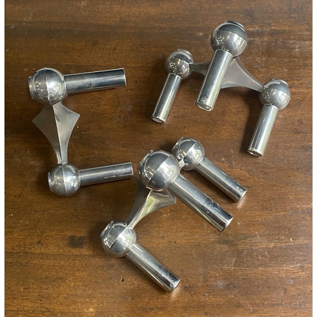 A beautiful set of three nagel candlesticks that can be stacked and arranged as desired. sold in their original box with...