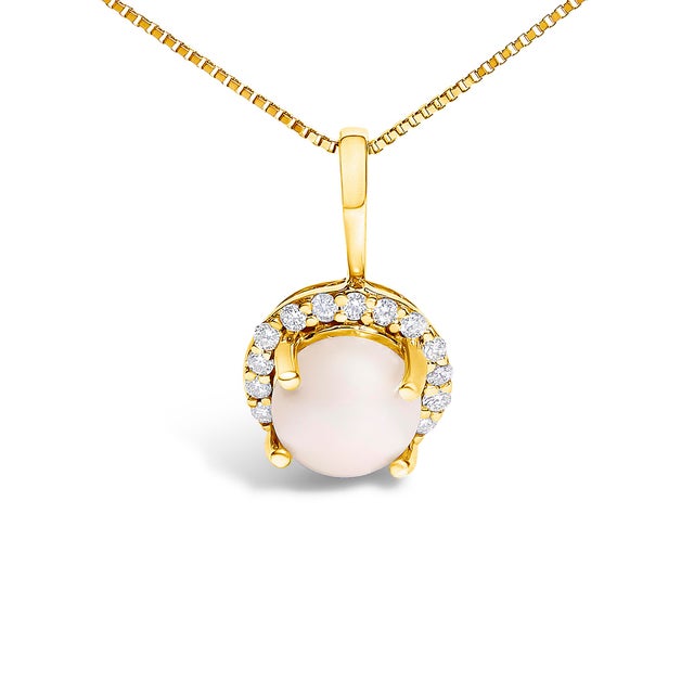 Adorn your neckline with the exquisite allure of this 10K yellow gold pendant necklace, where the warmth of the metal...