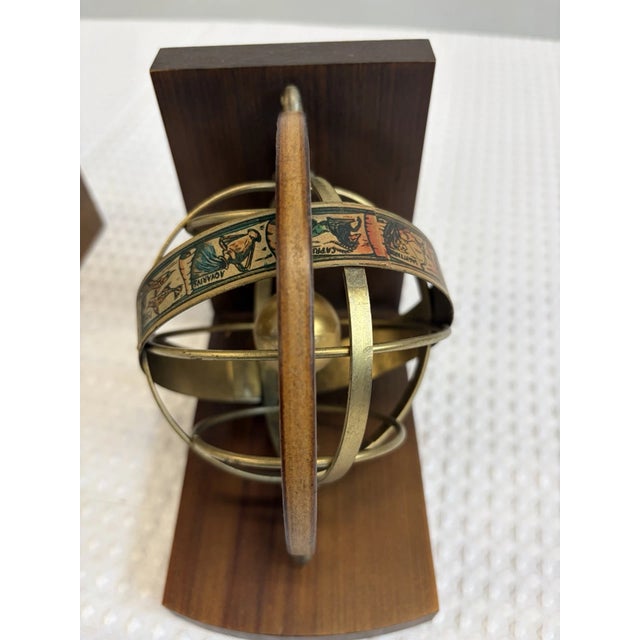 Bring timeless sophistication to your home or office with this **Vintage Italian Armillary Sphere Zodiac Bookends Set**....