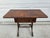 A beautiful lyre-based side table with one drawer and a banded crotch mahogany top. This piece is on clawfoot casters and...