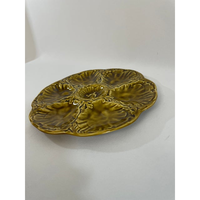 A striking glazed earthenware French Majolica (or barbotine) Oyster Plate crafted by the famous Gien workshop in France....