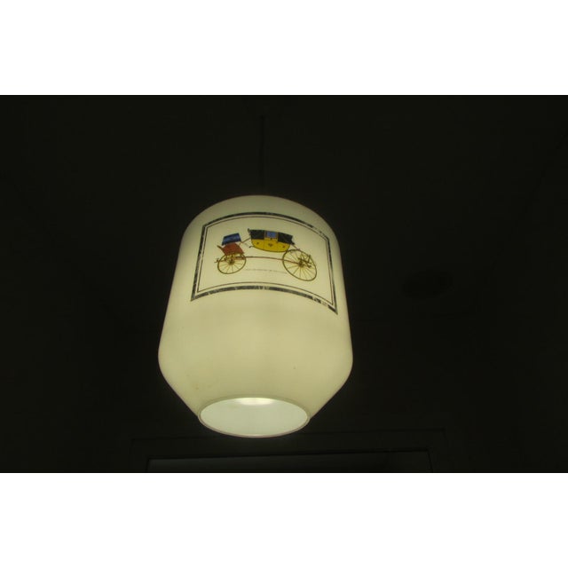 Elegant chandelier with a white opaline glass shade. It will delight lovers of vintage cars and carriages. Up to 250V...