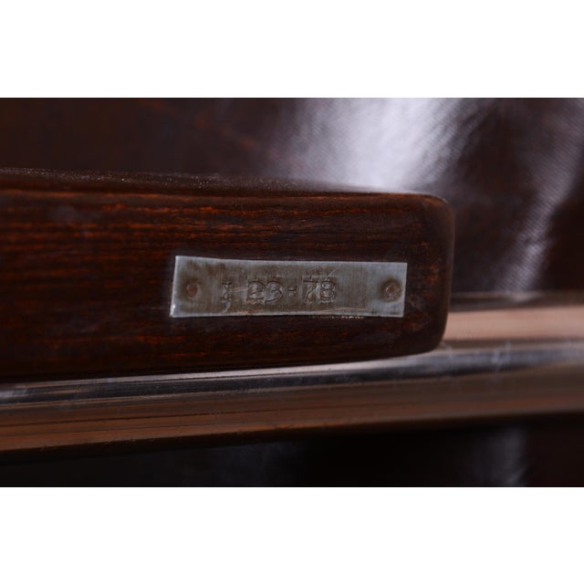 This exceptional pair of armchairs is a masterpiece of 20th-century modern design, attributed to the renowned designer...