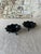 Add a touch of sculptural elegance to your space with this striking pair of vintage black glass candle holders. Shaped...