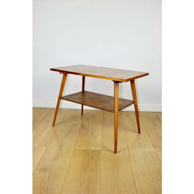 Polish coffee table, console from the 1970s, square and multifaceted shape. A practically square wooden coffee table with...