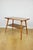 Polish coffee table, console from the 1970s, square and multifaceted shape. A practically square wooden coffee table with...