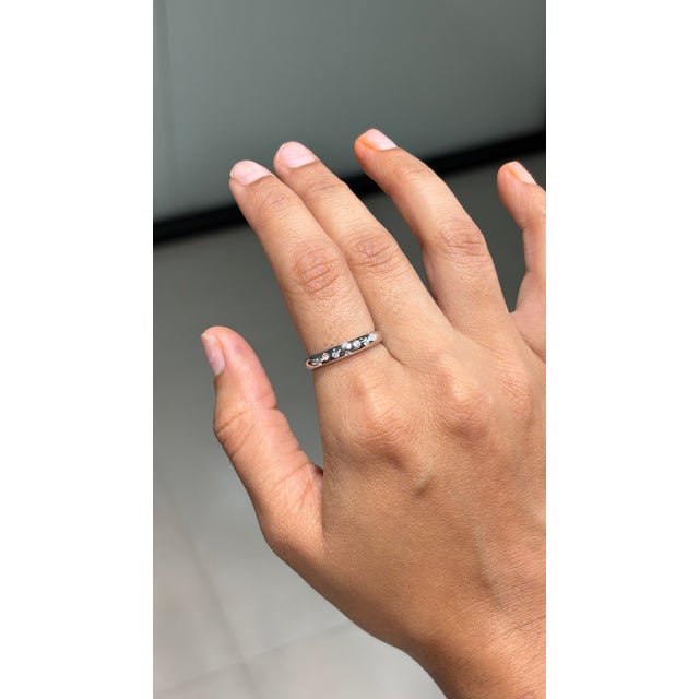 This elegant diamond band ring features a 0.14 carats of natural diamonds, set in 14K white gold. Each diamond measuring...