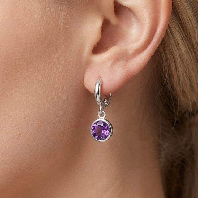 Refined and effortlessly elegant, these gemstone drop earrings combine modern minimalism with timeless charm. Designed...