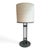 Rare pair of Armature table lamps from designer Solis Betancourt retailed by Holly Hunt. Patinated iron with simplistic...