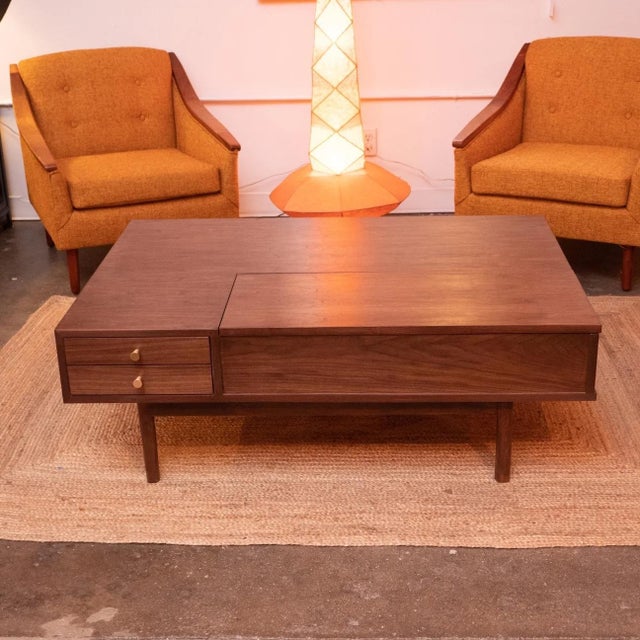 Inspired by Mid-Century Modern design, this stunning Sunbeam Exclusive Ariana Peek-A-Boo Coffee Table features handcrafted...
