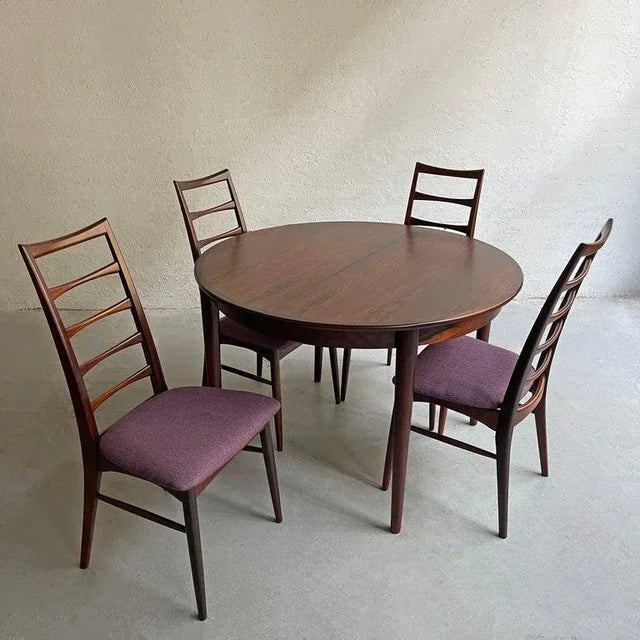 Danish Modern, rosewood dining set by Niels Koefoed, Hornslet Møbelfabrik features a 43 inch round dining table that...