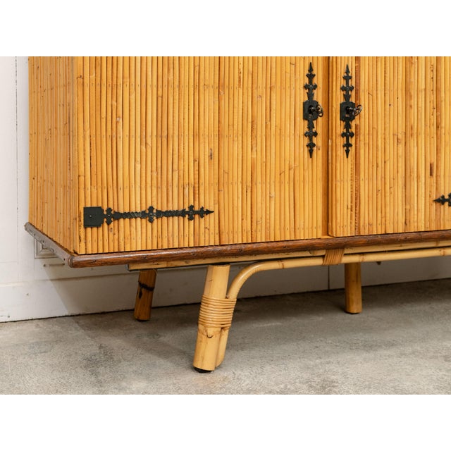 A 1960s split rattan and metal sideboard attributed to Adrien Audoux and Frida Minet. A design classic, this rattan...