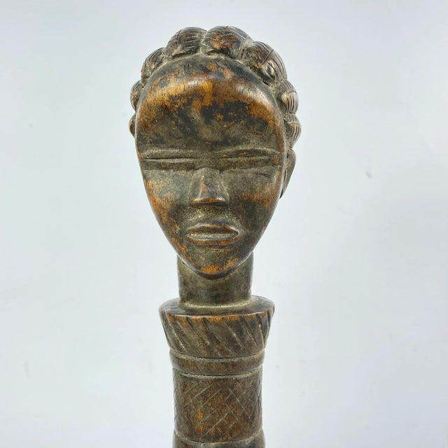 This finely carved wooden scepter originates from the Dan people of Liberia and CÃ´te dâIvoire, a culture renowned for...