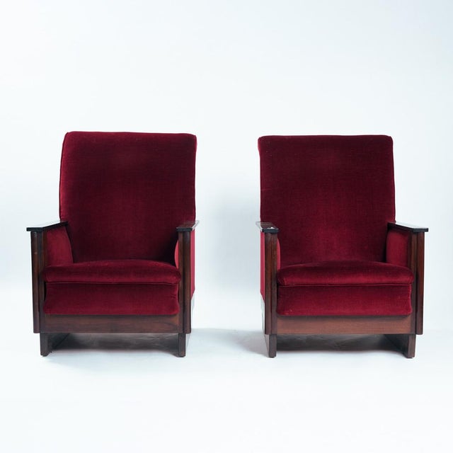A striking pair of Amsterdam School armchairs, defined by their sculptural presence and expressive craftsmanship....