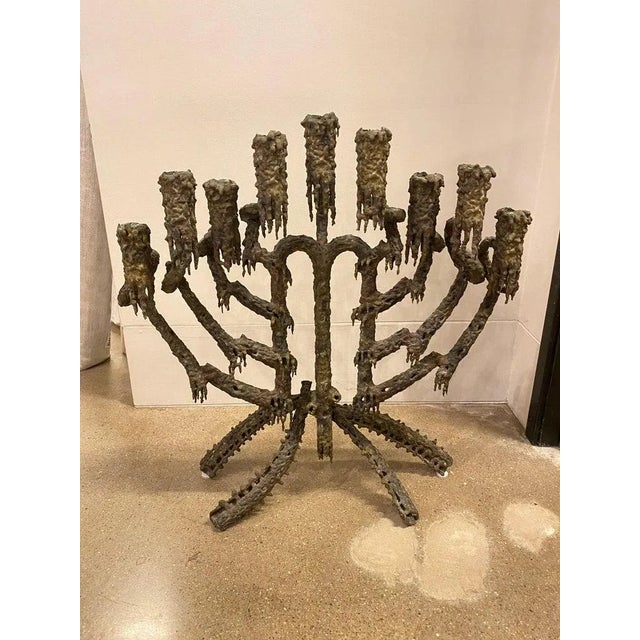 Solid bronze candelabra for nine candles. Extraordinary piece of Brutalist design by California artist, Daniel Gluck. 1970's.