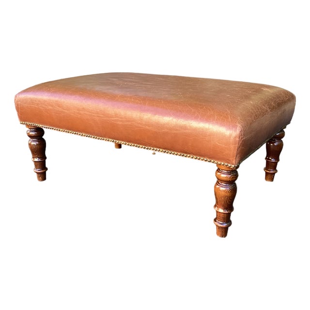 Late 20th Century Cognac Leather Rectangular Ottoman With Turned Wood Legs & Nailhead Trim For Sale