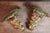 Pair of wall brackets in painted and carved gilt wood. DIMENSIONS: 0.52m wide, 0.31m deep, and 0.50m high.