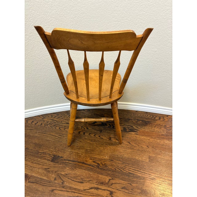 Crafted by the renowned S. Bent & Bros. of Gardner, Massachusetts, this beautifully preserved solid maple Windsor side...