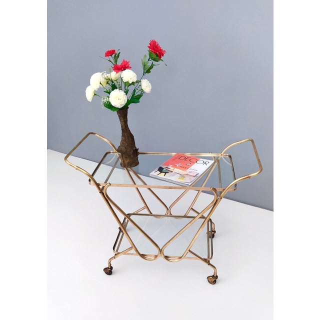 Made in Italy, 1950s. This serving cart is made in brass and two glass shelves. It is a vintage item, therefore it might...