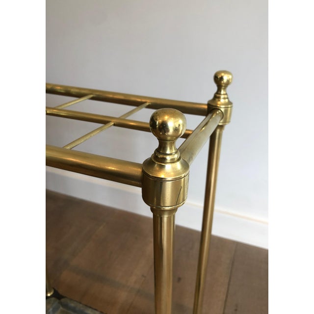 This lovely rectangular umbrella stand is made of brass and cast iron. It is a French work. Circa 1900