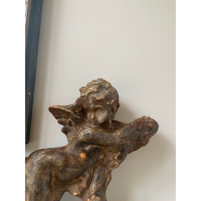 A wonderful gilt wood sculpture of putti, cherub or angel for wall hanging or display on shelves to admire. This was a...