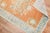 An early 20th-century orange field antique Oushak scatter size rug Measures: 3'7” x 4'10”.