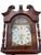 A striking mahogany grandfather clock that commands attention in any room. This substantial timepiece features rich, warm...