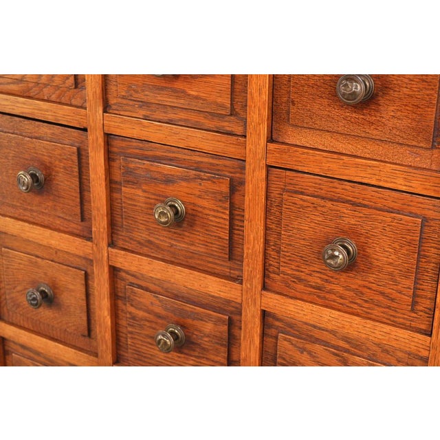 Beautiful, shallow oak chest of drawers with many drawers. Dating circa 1900. The front of the drawers is special and...