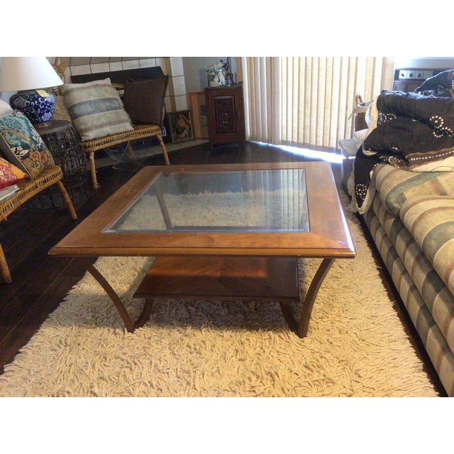 Classic style wooden side table with glasses in the center. Two layer.