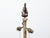 A French steel and brass floor lamp from circa 1930 with two light sockets, scrolling legs and foliage motifs. This French...
