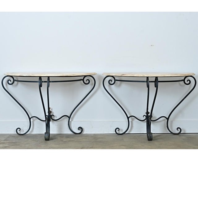 These matching demilune console tables are made from a stunning light brown onyx. The tops were cut from the same piece of...