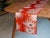 Hi no de. The rising sun. The starburst at first light — woven here in vermilion silk with silver radiance, modern in...