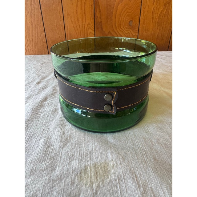 Vintage glass ice bucket in a beautiful emerald color. Very French. Probably from the 60s The decorative leather band has...
