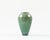 Small porcelain vase with crystalline glaze in celadon green. Some of the crystal patterns resemble Ginko leaves. Made by...