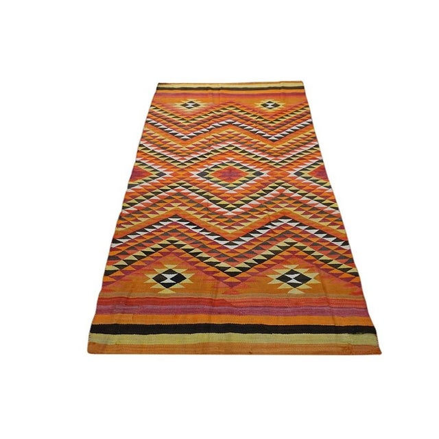 Antique Navajo American Geometric Flat Weave Rug, Circa Date: 1890s. This exceptional example of Native American weaving...
