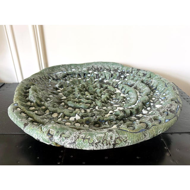 A substantial stoneware vessel thickly coil-built by hand in a concave plate form by Japanese contemporary ceramist Satoru...