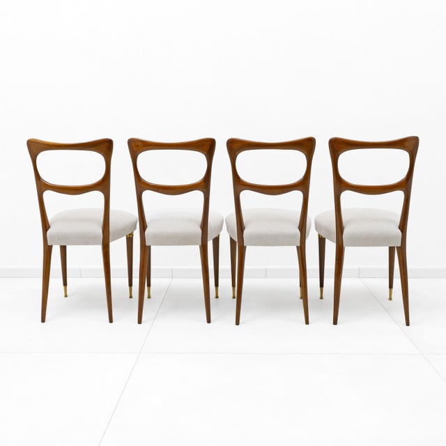Gorgeous set of four mid-century Italian dining chairs attributed to Paolo Buffa, recently reupholstered in ivory fabric,...