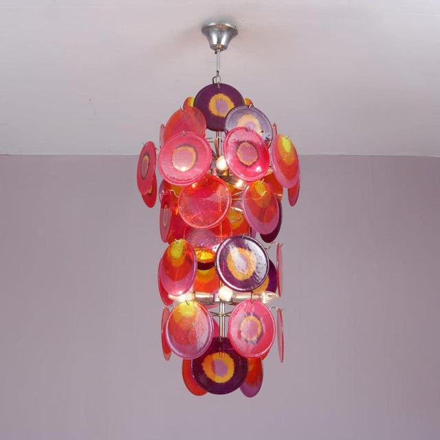 1970s Disk chandelier by Aro Leuchten, Germany. A striking example of Space Age lighting design, featuring layered...