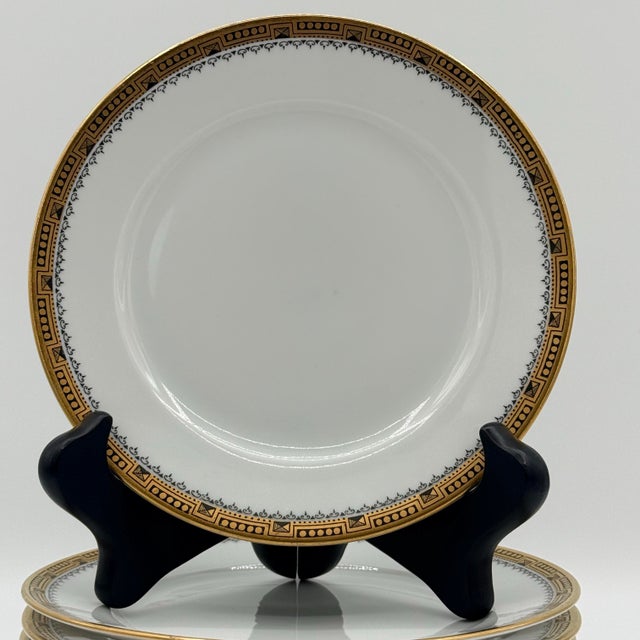 The Skinny Eight Rosenthal Bavaria bread plates with a sharp Greek key border and warm gold rim—classic European tableware...