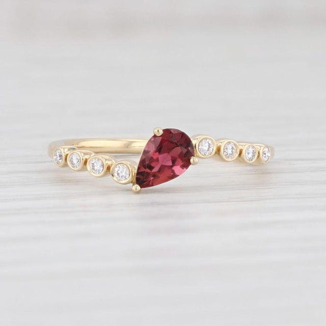 This is a new ring. Gem: Natural Tourmaline - 0.40 Carats (4 x 6 mm), Pear Brilliant Cut, Dark Pink Color - Natural...