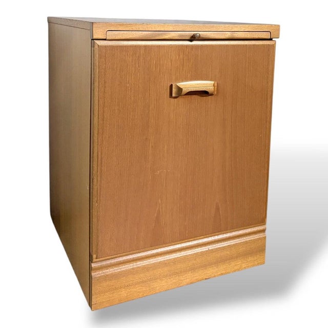 A beautifully made mid-century bedside cabinet by McIntosh, showcasing the brand’s reputation for quality British...