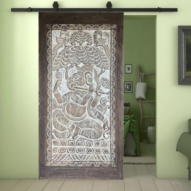 Hand-carved Ganesha wall panel customized into a sliding barn door or hinged door is one of all favorite pieces to...